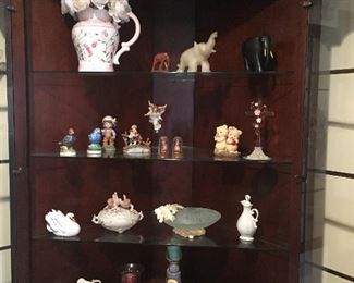 Corner curio cabinets (2) Beautiful condition with storage in bottom.  $150 for the pair or $75 each
Figurines