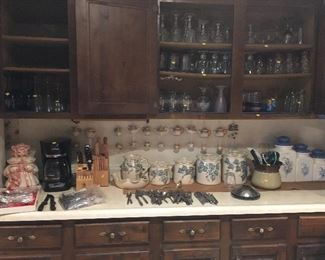 Cookie jar, canister sets, silverware, tea cups, coffee maker (gone), crocks 