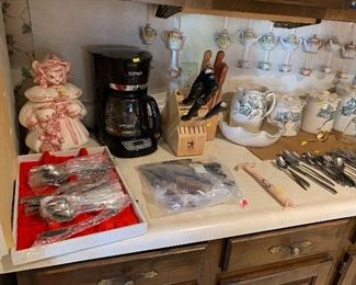 silverware in red still available, 1 set of knives, vintage cookie jar and tea cups