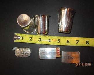 Assorted sterling including Russian shot glasses, gold wash shot glass, Italian pill case, and two sterling match holders