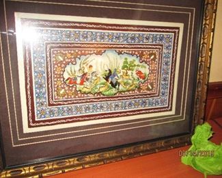 An Indian artwork in a matted and gilded frame.
