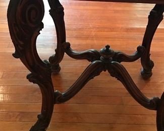 Intricate legs on antique parlor table