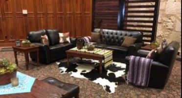 Leather lounge seating and cowhide rugs