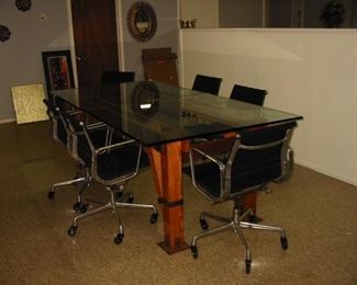 glass top table and rolling office chairs