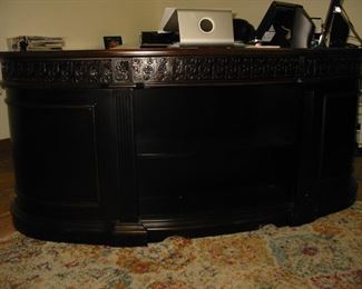 very impressive wooden rounded front desk
