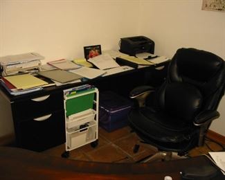 wooden desk (quite a few rolling desk chairs)
