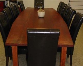 large conference table and leather slipper chairs