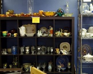 12 cube Display Cabinet (available Sunday P.M.) with glassware and pottery including 2 McCoy Tea Sets - 1 Ivy the other Pinecone pot has no lid. Items sold separately.