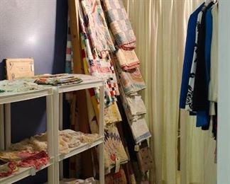 11  Quilts and 3 Quilt Tops on Two separate Library Ladders. Items sold separately.