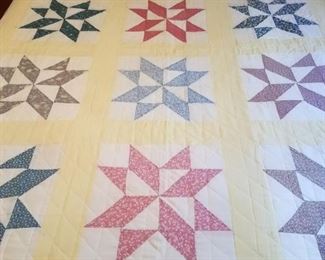 Several hand made and machine made quilts