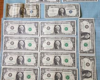 12 Mint 1995 $1 Bills. 10 of the $1 bills are consecutively numbered. Two are not. All are in mint condition. Also includes 1957 and a 1957A silver certificates.