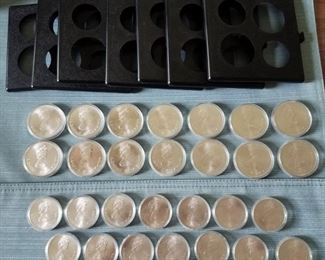Set 28 Sterling Silver Canadian Olympics Coins. Includes fourteen 45mm $10 coins (each containing 1 1/2 ounces of silver) PLUS fourteen 38mm $5 coins (each containing .75 ounces of silver). Total silver weight of all coins is 28 ounces.