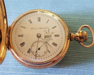 A running Hampden 17 Jewl pocket watch in a 14K gold filled Dueber Special case. Has a beautifully painted dial with a very faint hairline near the numeral 3 (see closeup photo). Serial #1,025,271 dating the watch to 1897.