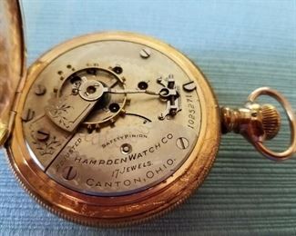 A running Hampden 17 Jewl pocket watch in a 14K gold filled Dueber Special case. Has a beautifully painted dial with a very faint hairline near the numeral 3 (see closeup photo). Serial #1,025,271 dating the watch to 1897.