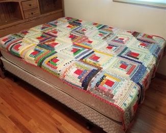 Several hand made and machine made quilts