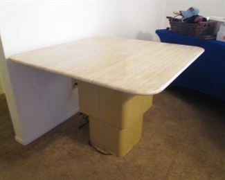Travertine Table at Dining Height, 40" X 40". This Table has an Adjustable Height from Dining to Coffee