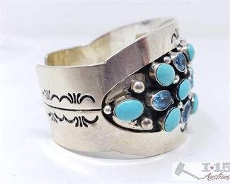 281: Vintage Sleeping Beauty Turquoise & Blue Topaz Sterling Silver Cuff Bracelet, 68.5g
Sterling Silver | Genuine Sleeping Beauty Turquoise & Blue Topaz | Vintage Sleeping Beauty Turquoise & Blue Topaz Calibrated Cluster Wide Cuff bracelet | Navajo Native American Southwest Indian Jewelry | Dimensions: Bracelet: 6" inner, 1" gap, 7" total, 1.5" face width Weighs approx 68.5g
Metal Type: Sterling Silver
Gemstones: Turquoise
Low Estimate: 750
High Estimate: 900