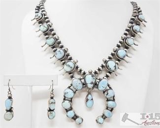 305:
Pansy Johnson Golden Hill Turquoise Squash Blossom Necklace, 142.7g
Sterling Silver | Genuine Golden Hill Turquoise | Pansy Johnson Golden Hill Turquoise Squash Blossom Necklace & Earrings Set | Navajo Native American Southwest Indian Jewelry | 2.75" x 2.75" center pendent, 9mm x 17mm bottom center stone, Earrings: .5" x 1.75" (for both) | Signed: P Johnson Weighs approx 142.7g, necklace measures approx 22" long
Metal Type: Sterling Silver
Gemstones: Turquoise
Low Estimate: 1800
High Estimate: 2400