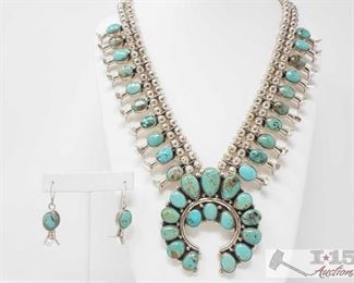 306: Charley Roanhorse Turquoise Mountain Turquoise Large Squash Blossom Necklace with Earrings, 191.2g
Sterling Silver | Genuine Turquoise Mountain Turquoise | Charley Roanhorse Turquoise Mountain Turquoise Large Squash Blossom Necklace & Earrings Set | Navajo Native American Southwest Indian Jewelry | Dimensions: Necklace: approx 28" length, 3" diameter center pendent, Earrings: .5" x 1.5" (for both) | Signed: C Roanhorse, Weighs approx 191.2g,
Metal Type: Sterling Silver
Gemstones: Turquoise
Low Estimate: 1500
High Estimate: 2000