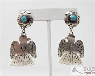 328: Tim Yazzie Navajo Turquoise & Sterling Silver Thunderbird Dangle Earrings, 11.8g
These are a pair of Navajo Sterling Silver & Turquoise Thunderbird Dangles. They are 2 1/4 inches long and just over 1 1/4 inches wide. These earrings are great pieces for any collection. They are signed and stamped by the artist Tim Yazzie. Weighs approx 11.8g