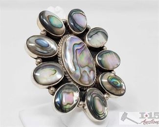 334:
Large Sterling Silver Albacore Ring, 34.3g
This is a beautiful Abalone and Sterling silver Navajo cluster ring.
It is a size 8.5. 2 1/4 inches in length and just under 2 inches in width. Stamped Silver and signed by Artist.
Weighs approx 34.3g, approx size 8
Metal Type: Sterling Silver
Gemstones: Abalone
Low Estimate: 150.00
High Estimate: 200.00