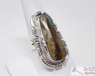 339:
Sheila Becenti Royston Boulder Ribbon Turquoise Sterling Silver Ring, 15.7g
Sterling Silver | Genuine Royston Turquoise | Sheila Becenti Royston Boulder Ribbon Turquoise Contemporary Etch Ring | Navajo Native American Southwest Indian Jewelry | Dimensions: 1.5" face width | Signed: Sheila Weighs approx 15.7g, approx size 9.5
Metal Type: Sterling Silver
Gemstones: Turquoise
Low Estimate: 200
High Estimate: 300