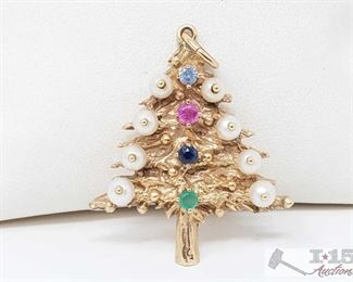 503:
14kt Gold Fresh Water Pearls and Semi Precious Stones in a Christmas Tree Pendant
14kt Gold Fresh Water Pearls and Semi Precious Stones in a Christmas Tree Pendant weighs approx 7.5g