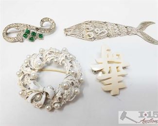 750:
Sterling Silver Fish Pendant and Miscellaneous Brouches
Sterling Silver Fish Pendant and Miscellaneous Brouches. Sterling silver fish weighs approx 6.4g
