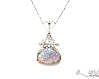755: Not Marked 18k Gold Necklace with Diamonds and what appears to be Opal Stone
Not Marked 18k Gold Necklace with Diamonds and what appears to be Opal Stone weighs approx 10.6g measures approx 10"