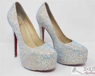 900:
Not Authenticated Pair of Christian Louboutin Rhinestone Heels
These are gently-used (non-authenticated) Christian Louboutin White Daffodile Swarovski strass 6” pumps, size 37 (6 1/2) Made in Italy.