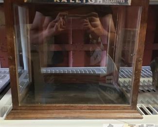 6601:
Vintage Raleigh cigarettes display case
This is a pretty rare and unique vintage Raleigh cigarettes display case with stained wooden frame and glass panels measures roughly 10.5” X 14.5” X 16 This display case is approx. 14.75" tall x 16.50" x 11"