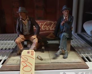 6603: Vintage Coke Cola bus bench model sculpture
Here’s an awesome RARE vintage Coca-Cola figurine! Well kept, this is the Coca Cola bus bench model sculpture by Michael Garman (1977) features two of his favorite characters from Magic Town series