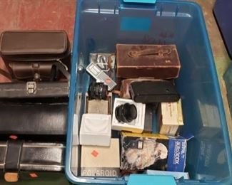 6608:
Various vintage cameras, lenses, and more!
This lot features more vintage cameras, lenses, camera parts, flashes, straps, cases, and accessories. Approx. 6 cases, 1 macro lense, 1 kalt lense, and more