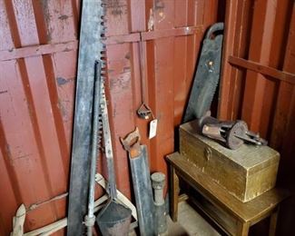 6632:
Antique Yard Tools with Small Desk and Wood Box
Shown here are vintage yard tools still in useful working order, a water well pump handle, a wooden box hand made in vintage hardwood, a branding iron, saw blades.