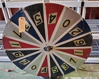 6640: Handmade Wheel of Luck w/ Base made out of a Wheel
This is a handmade Wheel of Luck w/ Base