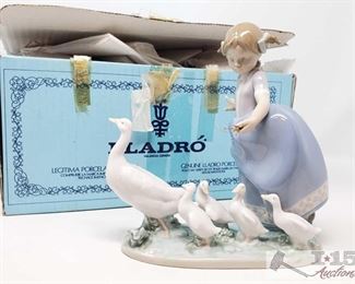 8507:
Lladro's "Hurry Now" from the Goose Girl collection
From the Lladro “Goose Girl” Collection this figurine is called “Hurry Now” #5503 type 439 by sculptor Antonio Ramos was retired in year 2005. This is a beautiful fine porcelain figurine of a young girl in a blue pinafore coaxing along a mother duck and her ducklings. In perfect condition in box! Measures approx 7" x 7"