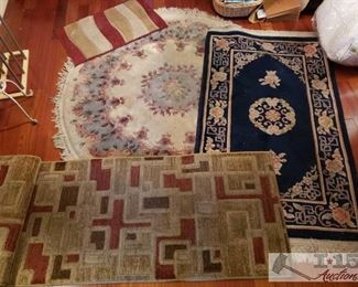 8615:
4 Rugs of Various Sizes
These are really pretty rugs!! Medium sized area rugs and a small throw rug of varied colors, including a beautiful round blue and rose on beige fringed rug, a runner rug from the Northport Collection in neutral earth tones (size 27”x91”), a beautiful wide-fringed gold and tan on black oriental style rug, and a textured latex backed throw rug in red, yellow, and tan abstract stripes. Each rug measures approx 27" x 91" ,68" x 37", 67" x 67" and 32" x 19"