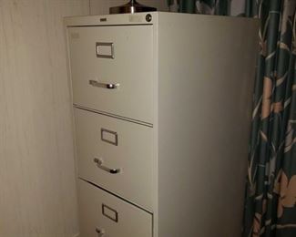 8640:
4 Drawer Filing Cabinet
Shown here is a large heavy duty commercial Staples vertical 4-drawer filing cabinet in putty color. Has key lock, holds letter-sized files.