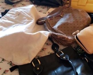 8711:
Approximately 17 Various Handbags
A hand or should bag for every occasion! This lot features about 17 various handbags, purses and satchels in various colors, sizes and materials.