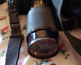 8750:
Cannon T50 Camera with Accessories
Featuring a vintage (1983-1989) Canon T50 SLR automatic 35mm film camera with 70-120mm lens, bag, and accessories!! This camera is considered a rare find especially in well-kept condition such as this one. Nice single-lens reflex camera compatible with Canon’s FD lens mount.