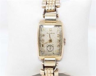 816:
10k GF Bulova Watch
10k GF(goldfilled) Bulova Watch measures approx 20mm. Does tick.