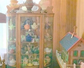 Lamps and a 3rd curved glass showcase filled with reamers.