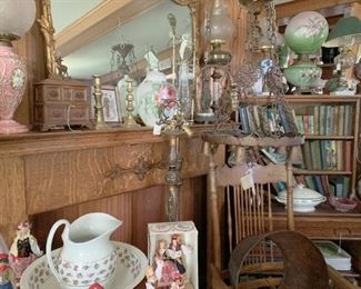 Oak mantle, books, lamps trampart