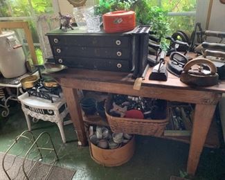 Loads of irons, tables, chairs, butter churns