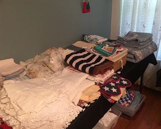 Eyelet window curtains, blue quilt set, doilys, placemats, sheer window scarves. All of the window curtains in the house will be for sale.!