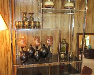 nice glass display shelf, nice pottery and decor