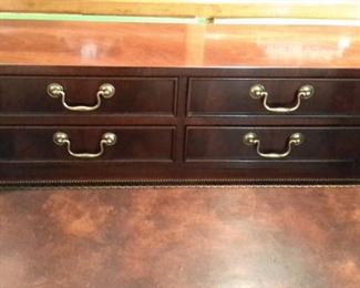 Rare Stunning Sligh Two-Tier English writing desk with leather top writing surface furniture of Holland, Michigan. The brass lock hardware accents the 9 drawers with original brass pulls. The curved back is beautifully finished so the desk can free-stand in a room. Lesser size listing as follows on another site...not same desk but same maker. https://www.1stdibs.com/furniture/tables/desks-writing-tables/sligh-walnut-curved-front-desk-leather-top/id-f_1141858/?gclid=Cj0KCQjwv8nqBRDGARIsAHfR9wCSzbjfRooPw17h1GRU9-mS9jtoJT_NI9xHfYXxVB7voUHKdIeTFxgaAhgsEALw_wcB&gclsrc=aw.ds