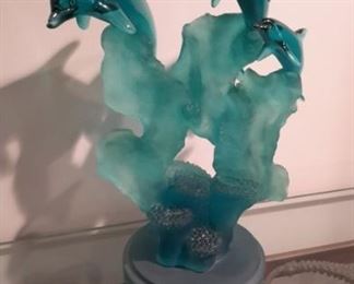 Hard plastic/resin dolphin sculpture.
