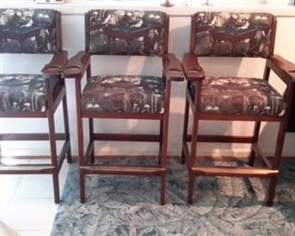 Three billiard spectator chairs with cup and cue stick holders, foot rests.