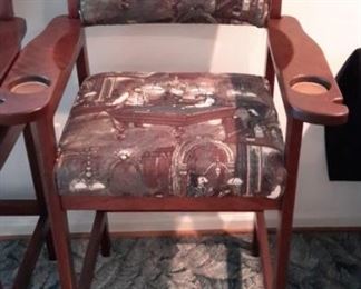 Three billiard spectator chairs with cup and cue stick holders, foot rests.